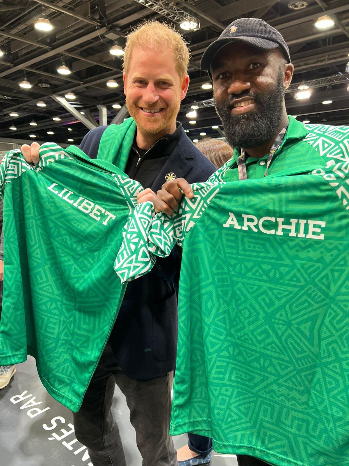 Derrick with Prince Harry 